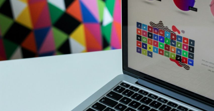 Close-up of a laptop screen displaying various brand logo designs