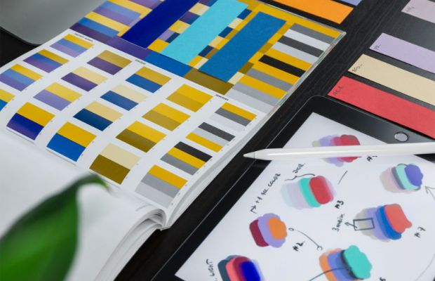 Branded design book showing colour swatches and brand guidelines